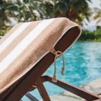 TIE and DRY Cabana Stripe Collection Towel Tied to Sun Lounger